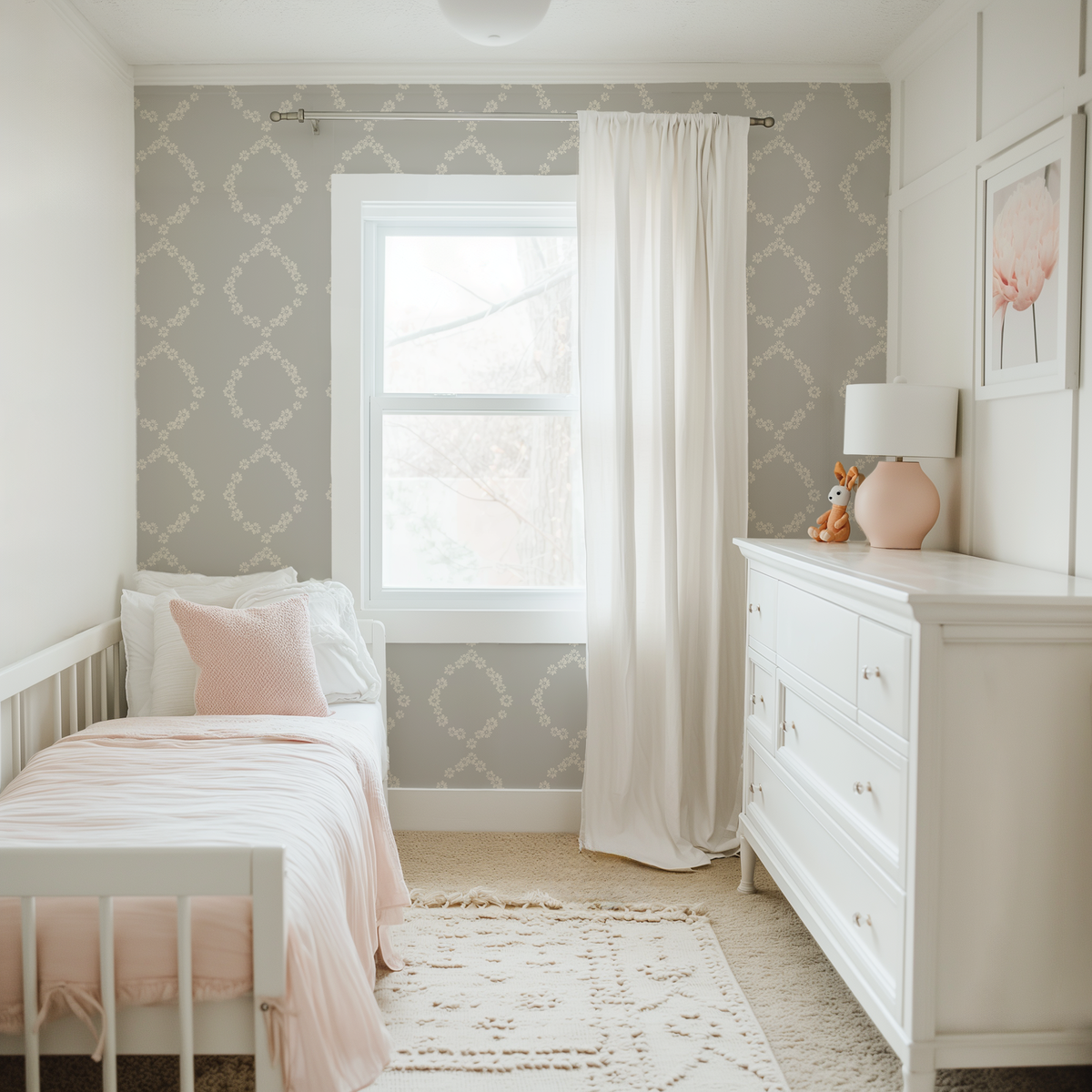 Children's bedroom with floral daisy chain wallpaper, white furniture, and a crib.