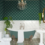 Dark green floral wallpaper installed in a classic bathroom with clawfoot tub and white tile wainscoting