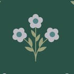 Close up of evergreen blossom wallpaper floral motif showing simple vintage flower illustration and muted tones