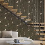 Modern living room with a staircase, floral-patterned wallpaper, and a sofa.