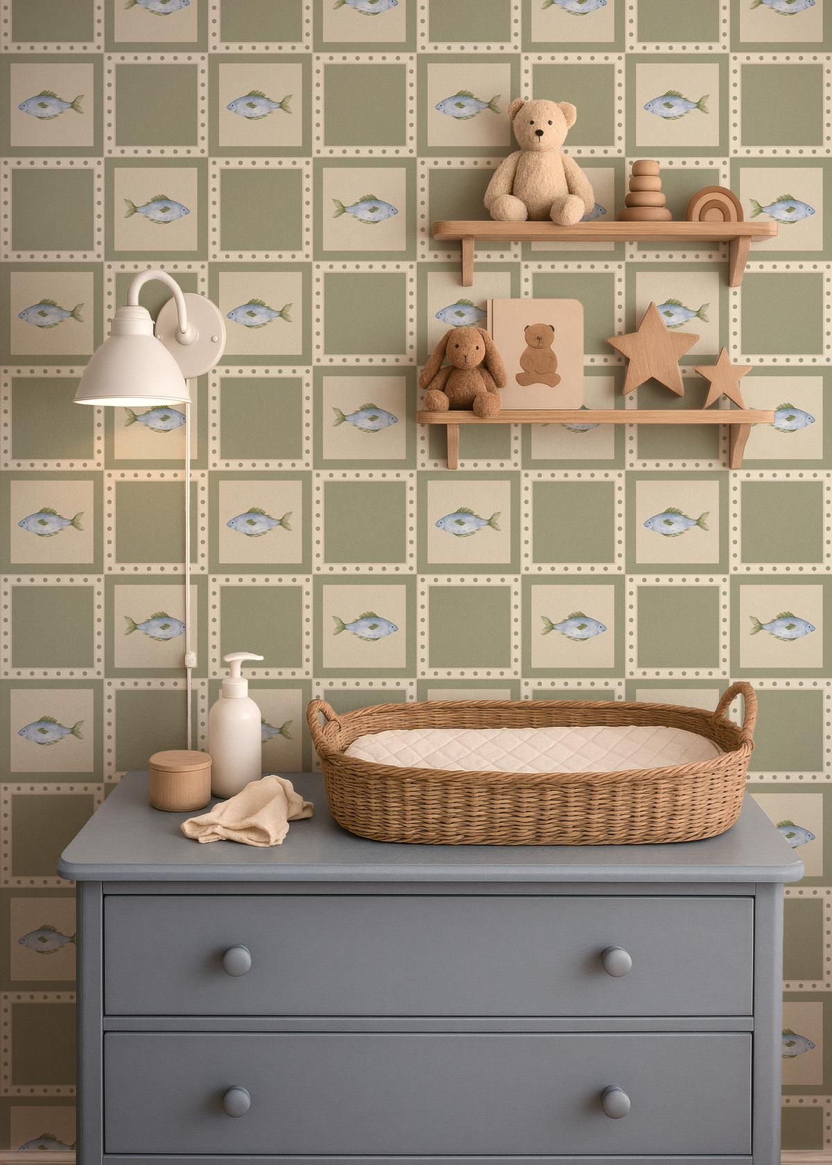 Gone Fishing wallpaper featuring watercolor fish and sage green squares styled in a baby nursery with blue dresser, wicker changing basket and wooden shelves.