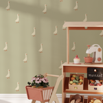 Goose wallpaper in kids playroom with wooden toy market and green background, farmhouse nursery decor