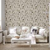 Neutral floral wallpaper styled in a cozy living room with light sofa and natural textures