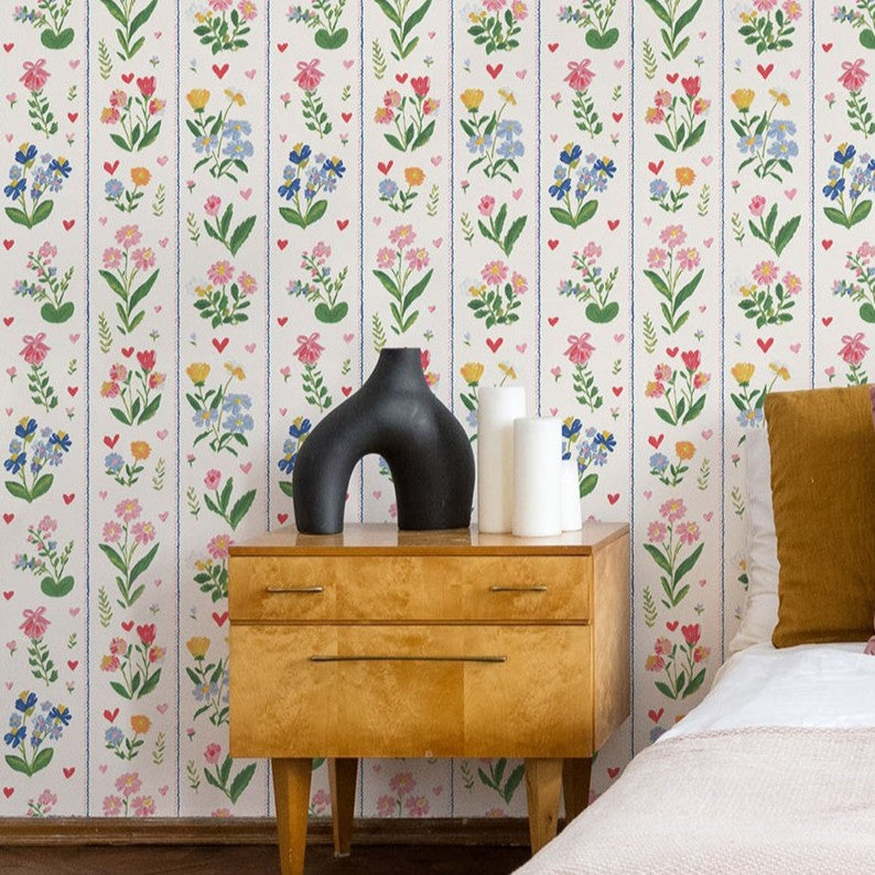 Traditional botanical stripe wallpaper with pink blossoms and blue florals on soft cream background