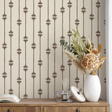Side view of dresser with dried florals in front of Homestead Stripe wallpaper