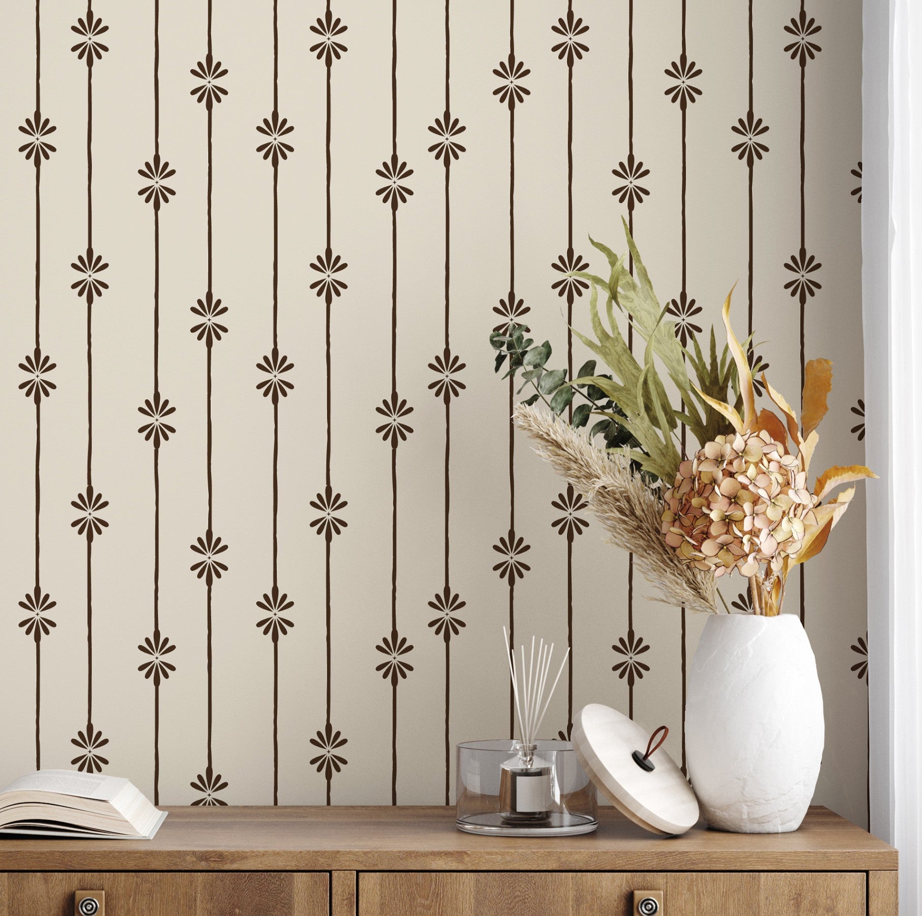 Side view of dresser with dried florals in front of Homestead Stripe wallpaper