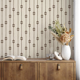 dresser with dried florals in front of Homestead Stripe wallpaper