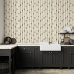 Kitchen with Homestead Stripe wallpaper behind black cabinetry and farmhouse sink