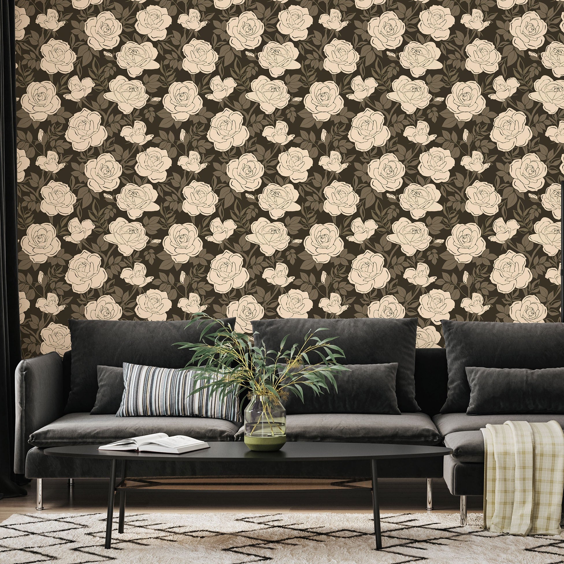 Living room with a black sofa against a wall with floral wallpaper