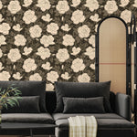 Vintage rose wallpaper installed in a moody living room with dark sofa and neutral decor