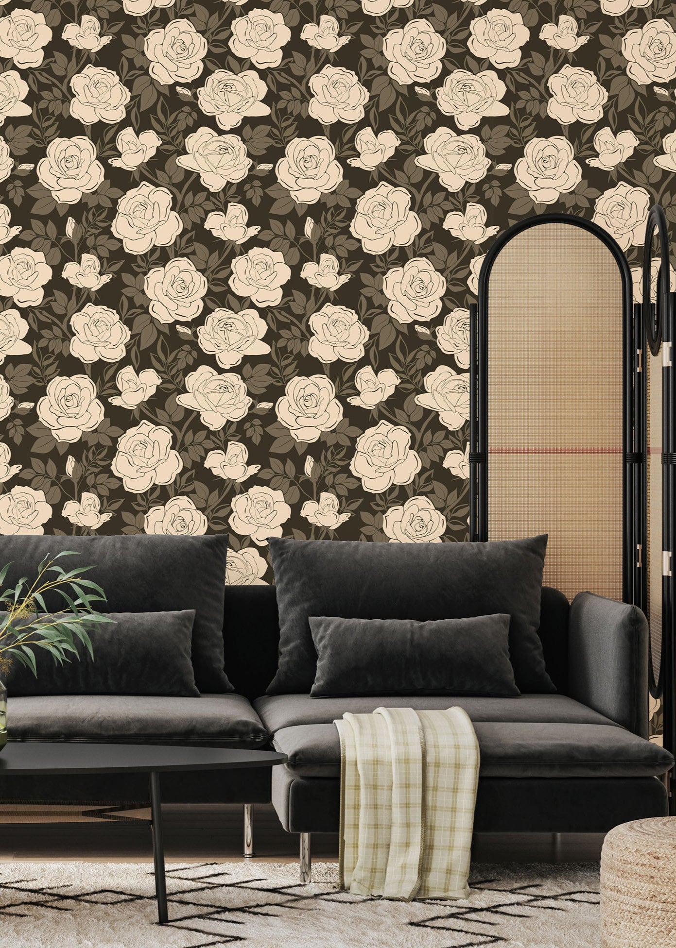 Vintage rose wallpaper installed in a moody living room with dark sofa and neutral decor