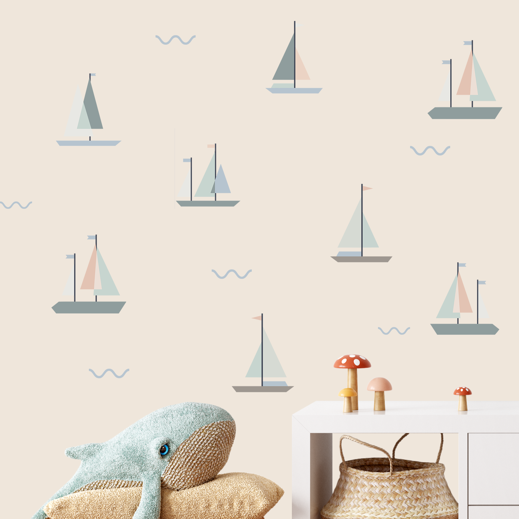 Nursery with neutral sailboat wall decals and plush whale decor