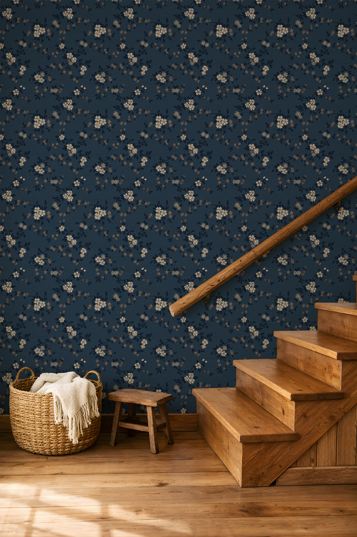Dark blue vintage floral wallpaper along a rustic wood staircase with cream botanical flowers and warm brown accents