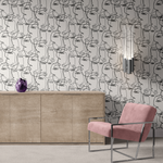 Chic interior with continuous line art faces peel and stick wallpaper and contemporary furnishings