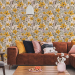 Living room with floral wallpaper, brown sofa, and decorative pillows.