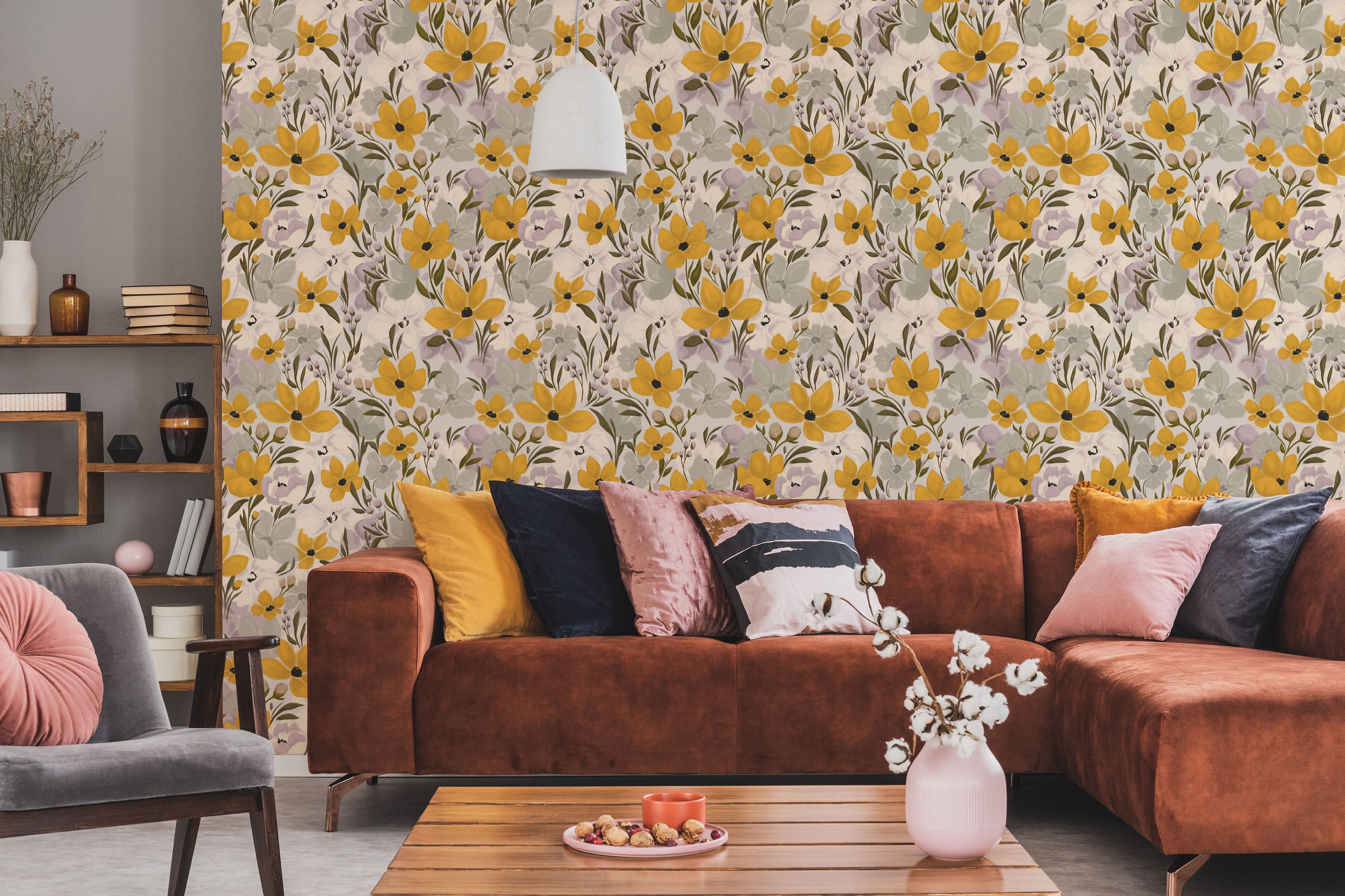 Living room with floral wallpaper, brown sofa, and decorative pillows.