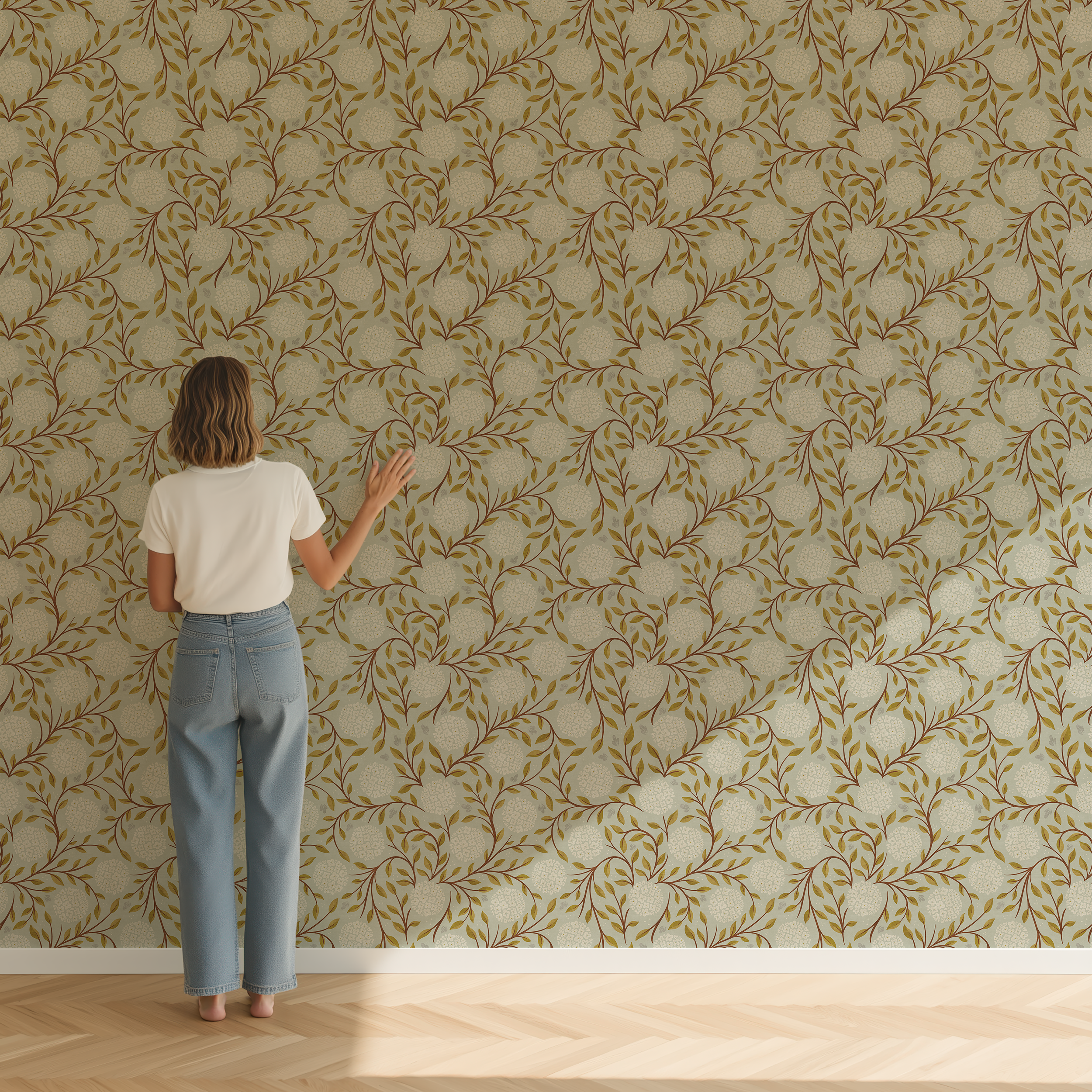 Person standing in front of a wall with a green and blue floral patterned wallpaper
