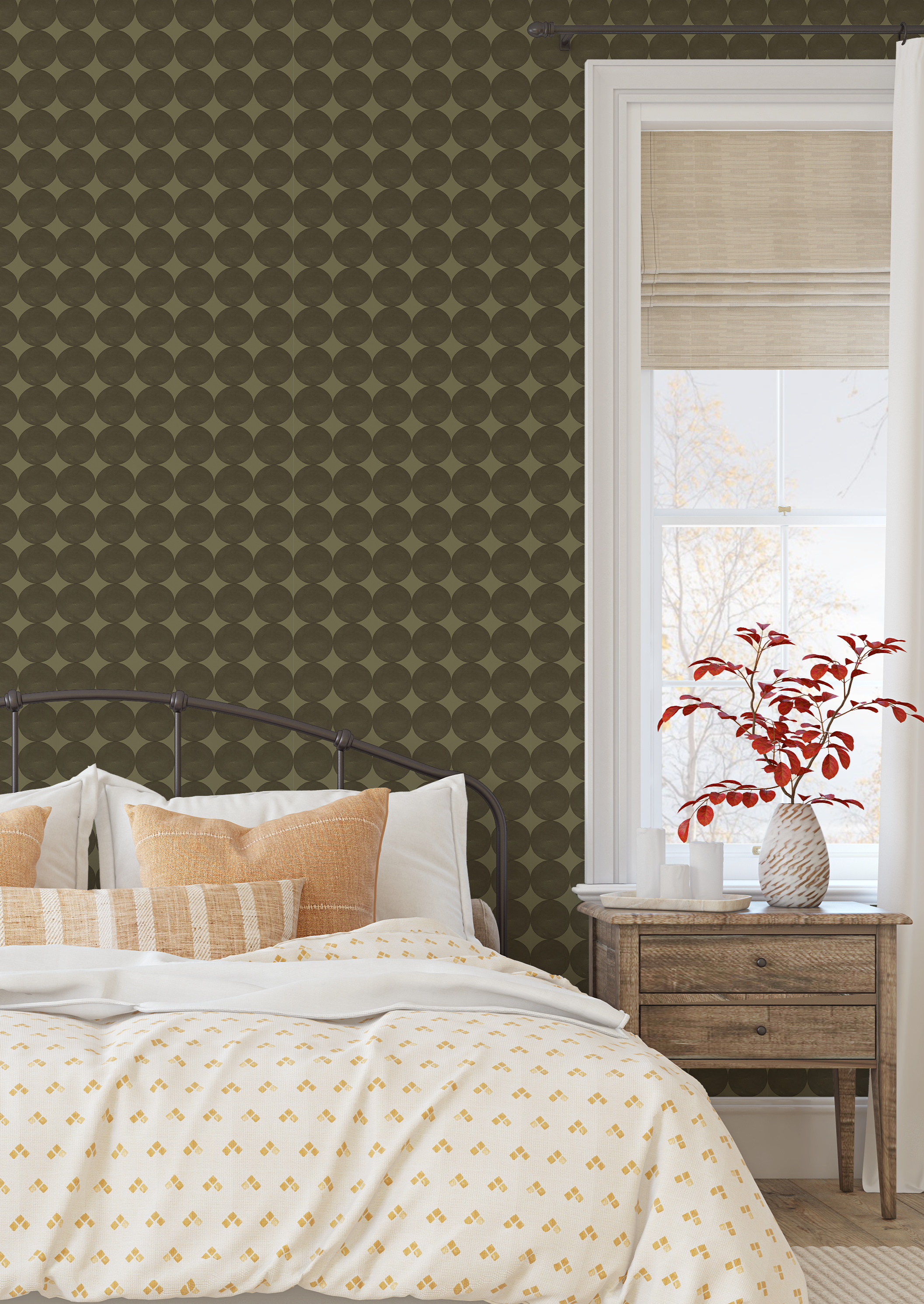 Bedroom with olive green dot wallpaper behind bed with neutral bedding and warm accents