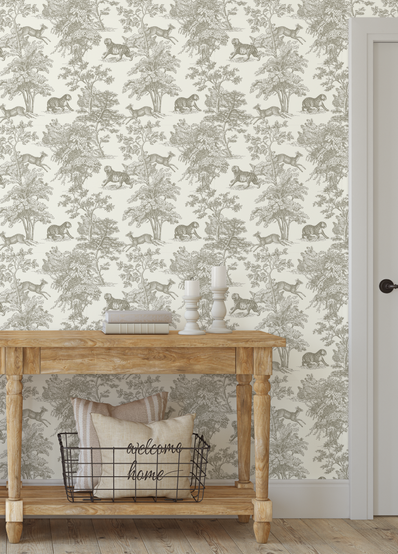 Neutral safari toile wallpaper styled behind wooden console table in warm neutral decor