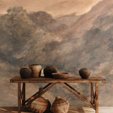 Old world wall mural styled with rustic pottery and wooden console table