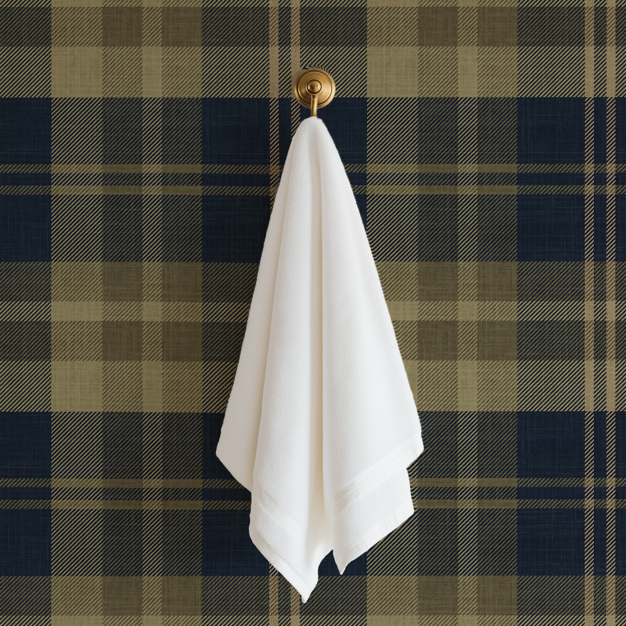 Oxford Plaid navy blue plaid wallpaper with brass towel hook and white towel in a classic bathroom