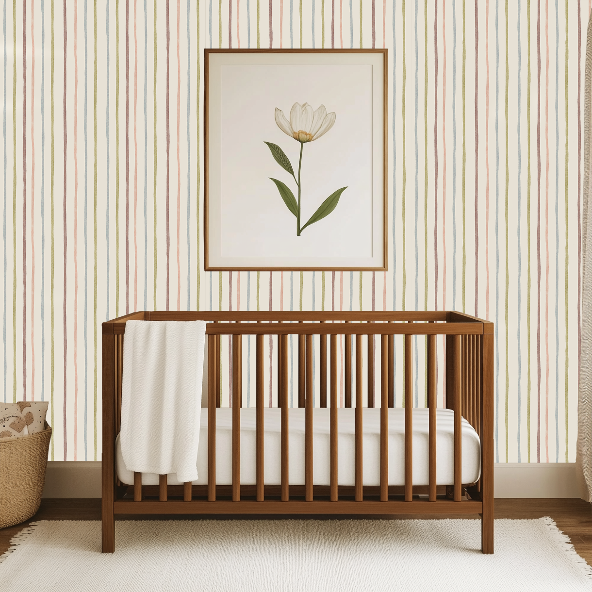 pastel stripe nursery wallpaper behind wooden crib with soft watercolor vertical stripe pattern