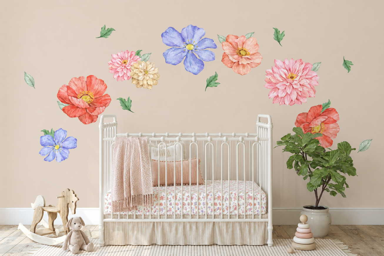 Pastel floral nursery wall decals with watercolor flowers arranged above a white crib in a neutral baby girl nursery