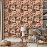 Peach anemone wallpaper styled in a cozy living room with neutral furniture and warm wood accents