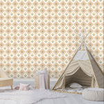 Children's room with a floral diamond wallpaper, sofa, teepee, and soft rug.