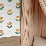 Petal Polka Dot Decals in warm yellow and green floral shapes beside canopy bed