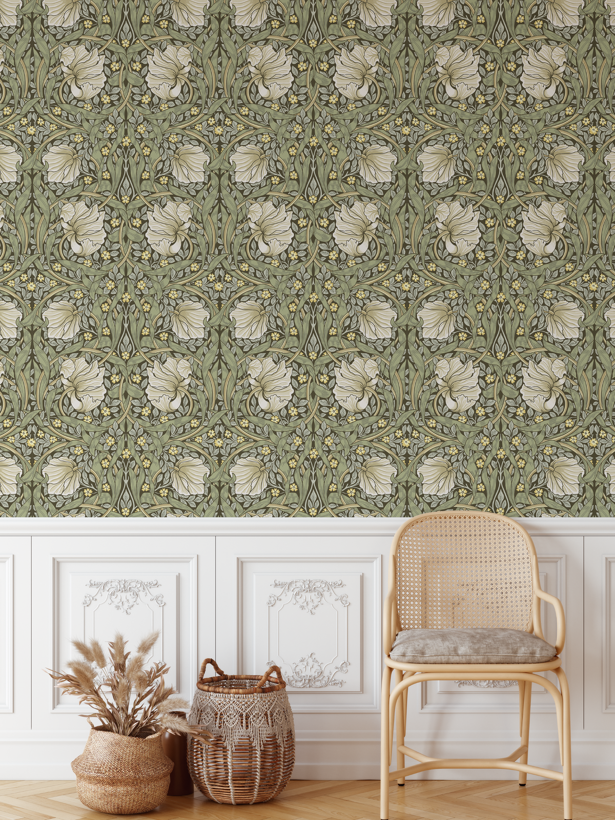Pimpernel Olive vintage botanical wallpaper styled above white decorative wall paneling and a cane chair
