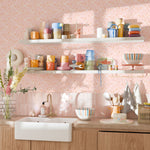 Eclectic kitchen with colorful mugs and dishes against Bloomfield floral wallpaper backdrop
