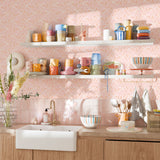 Eclectic kitchen with colorful mugs and dishes against Bloomfield floral wallpaper backdrop