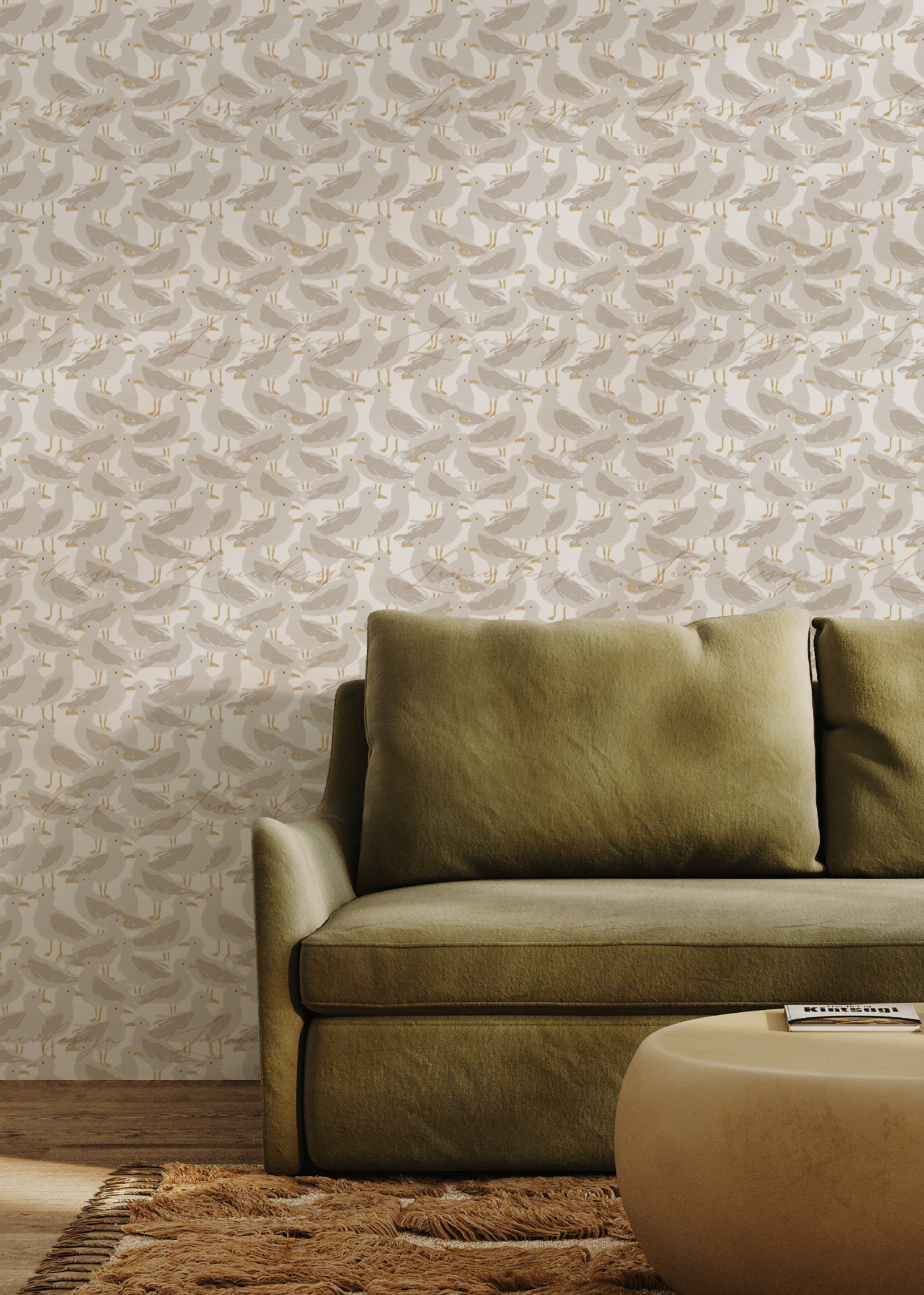 An olive green fabric sofa with two matching back cushions set against a wall covered in textured, light beige and white abstract patterned wallpaper. A round beige coffee table and a brown woven rug are visible in the foreground.