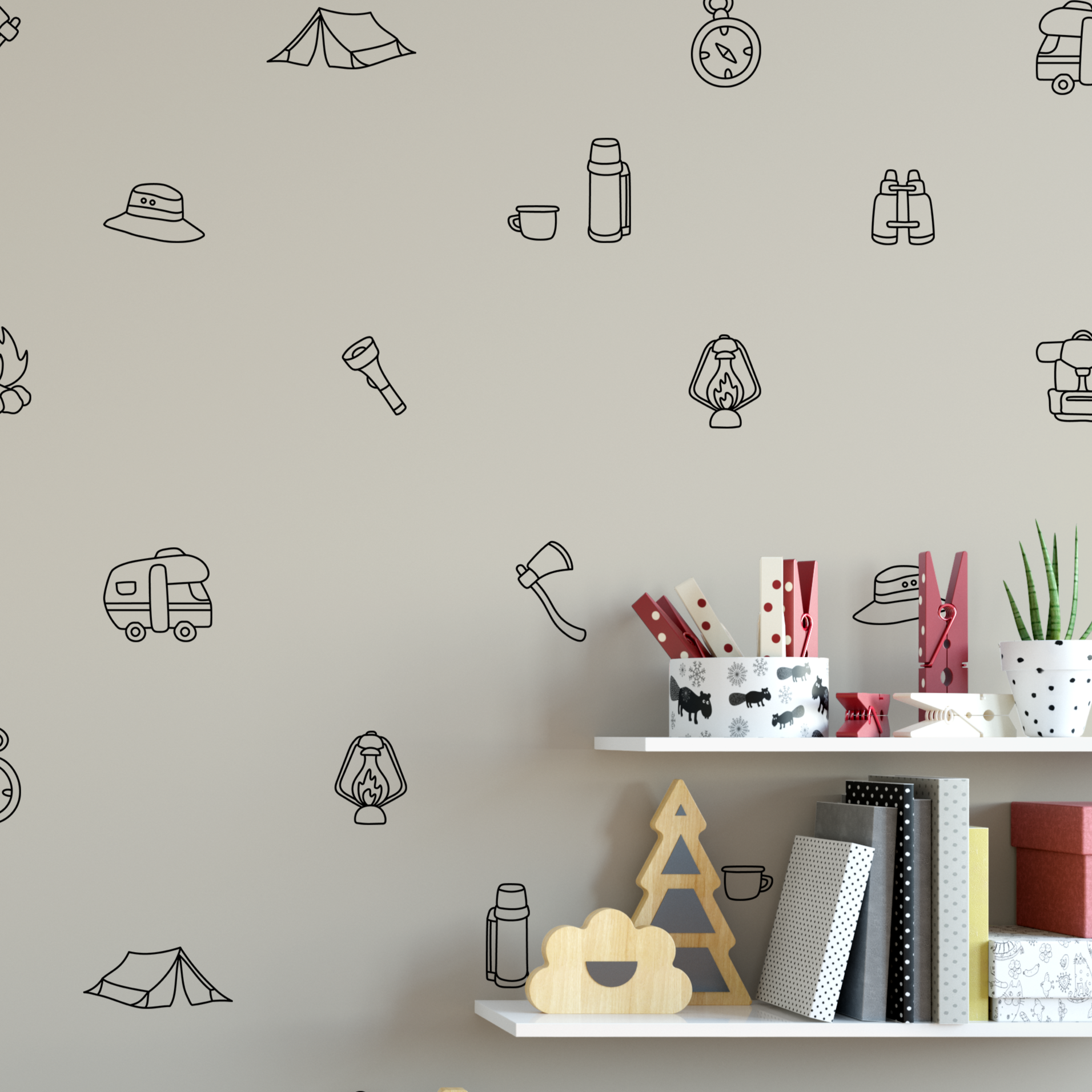 Close-up of black outline camping decals on tan wall with shelf decor and books in a child's room.