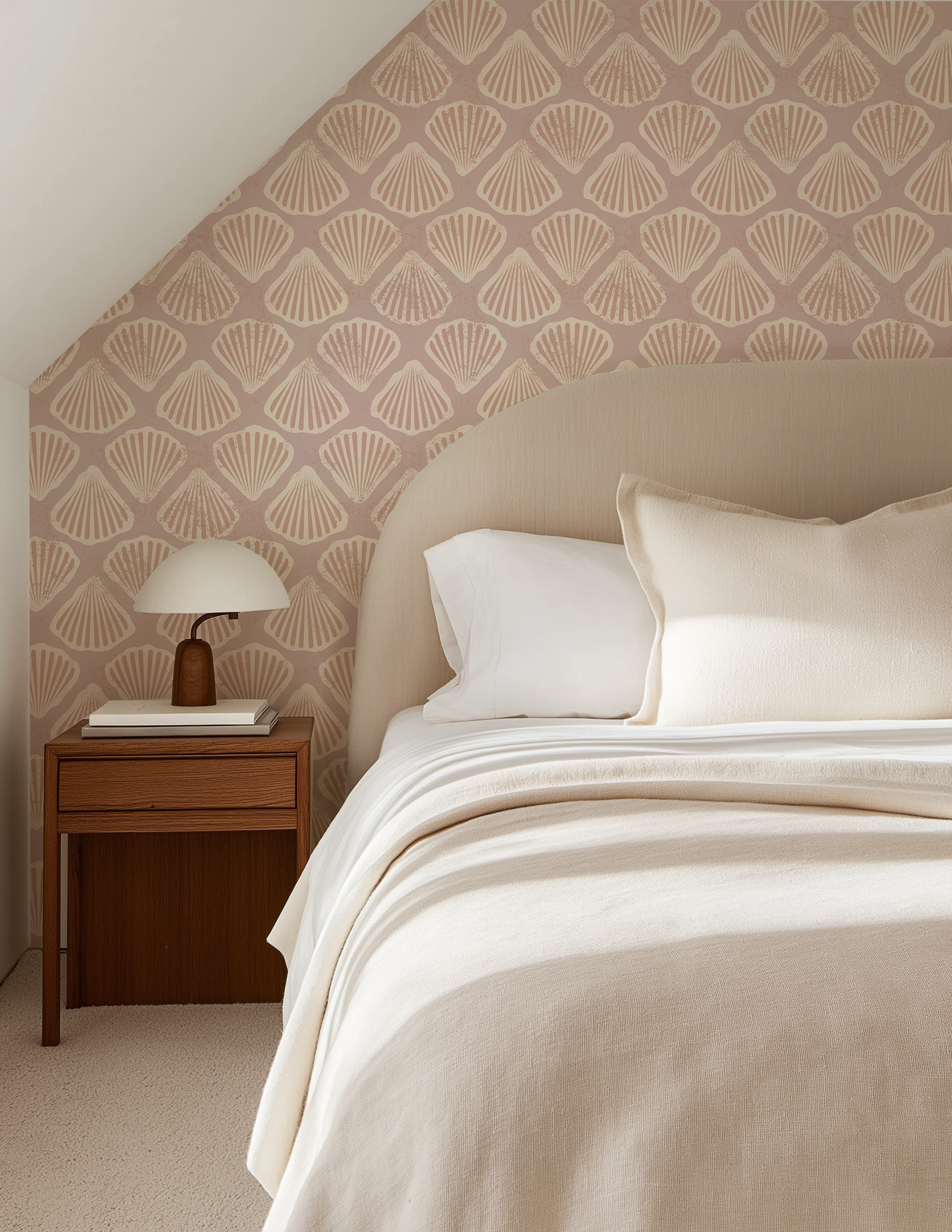 Sandy scallop shell wallpaper in a beach house bedroom with neutral bedding