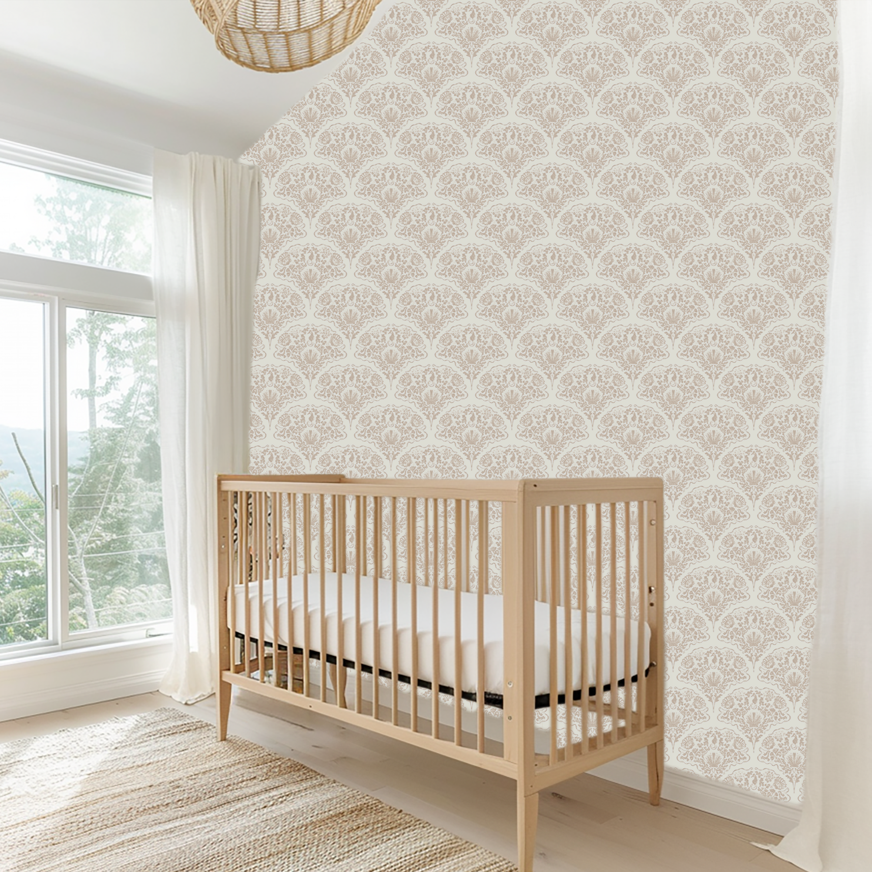 Neutral seahorse damask wallpaper installed in a bright nursery with crib and coastal-inspired decor
