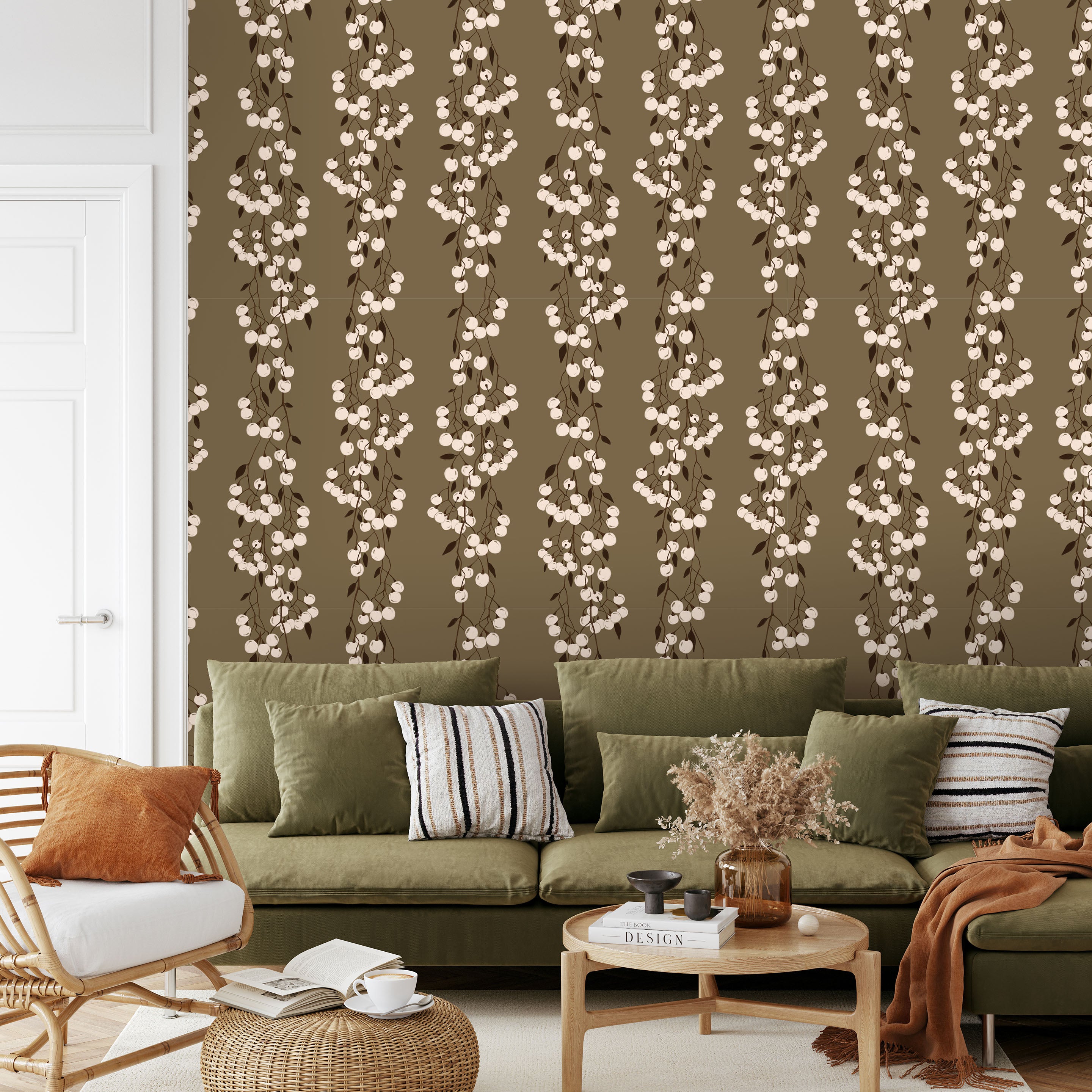 Snowberry Trail wallpaper installed behind a green sofa, highlighting the vertical botanical stripe design.