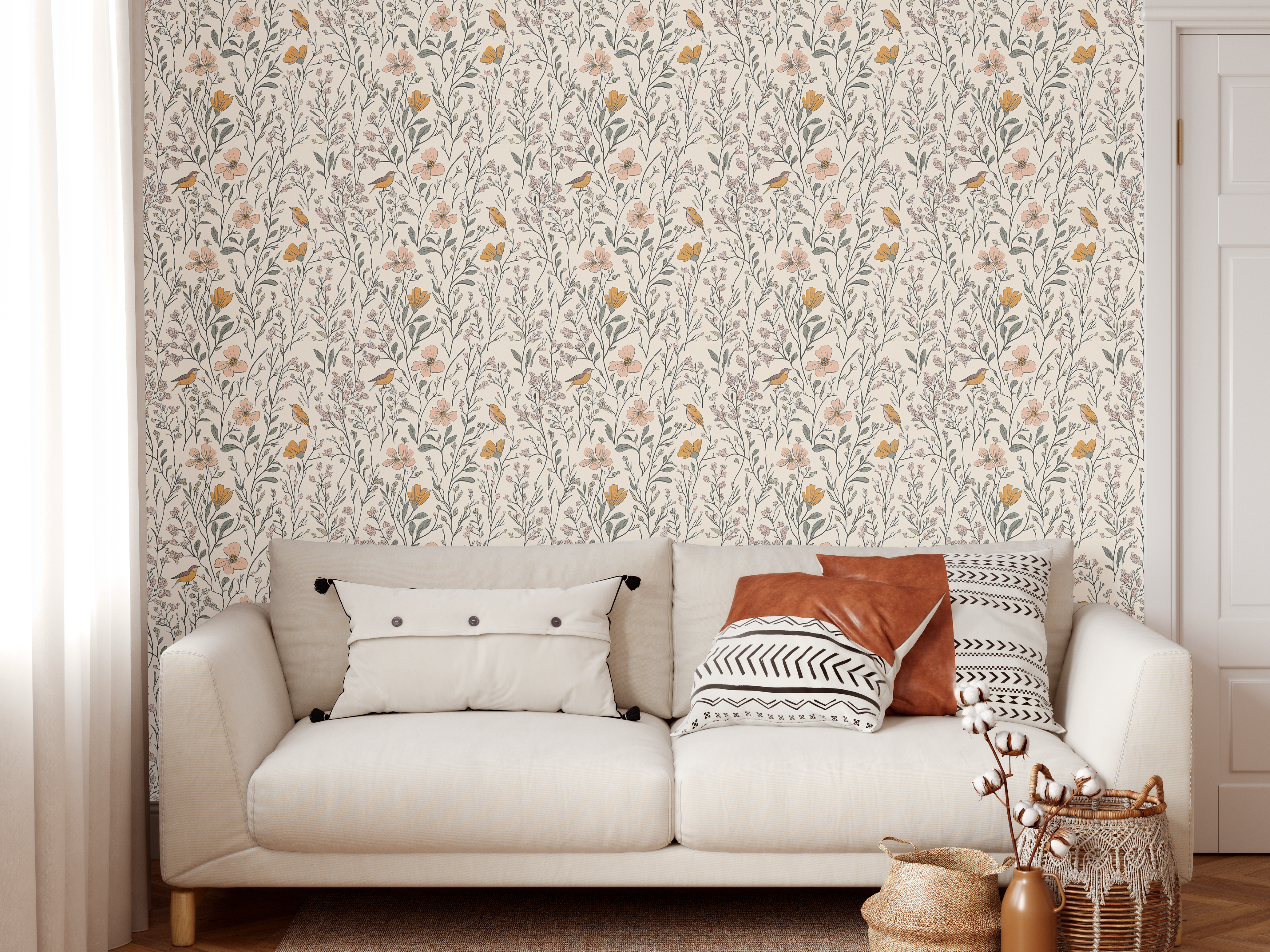 Living room with Songbird Meadow wallpaper behind a white sofa and neutral pillows