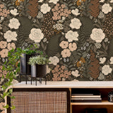 Stillwood botanical wallpaper accent wall behind a wood media console with modern planters