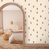 Strawberry wallpaper installed on an arched doorway and soft neutral bedding