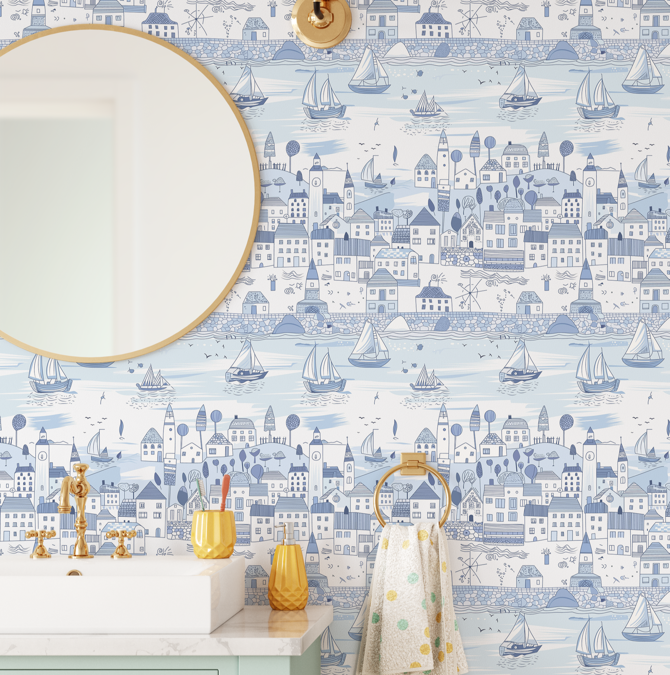Close-up of light blue nautical wallpaper with sailboats and illustrated coastal homes