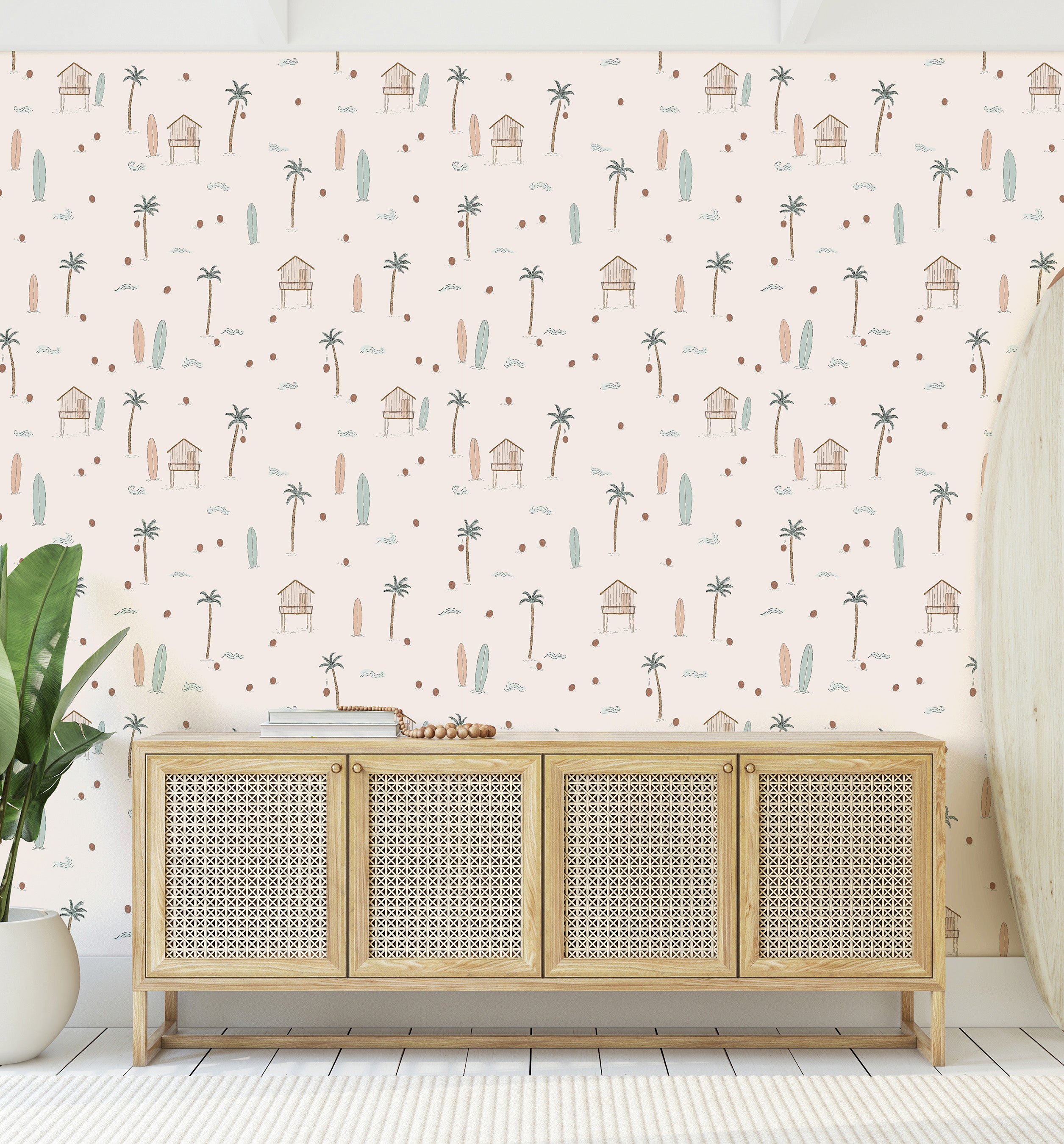 Rattan cabinet against a wall with a palm tree and beach hut pattern