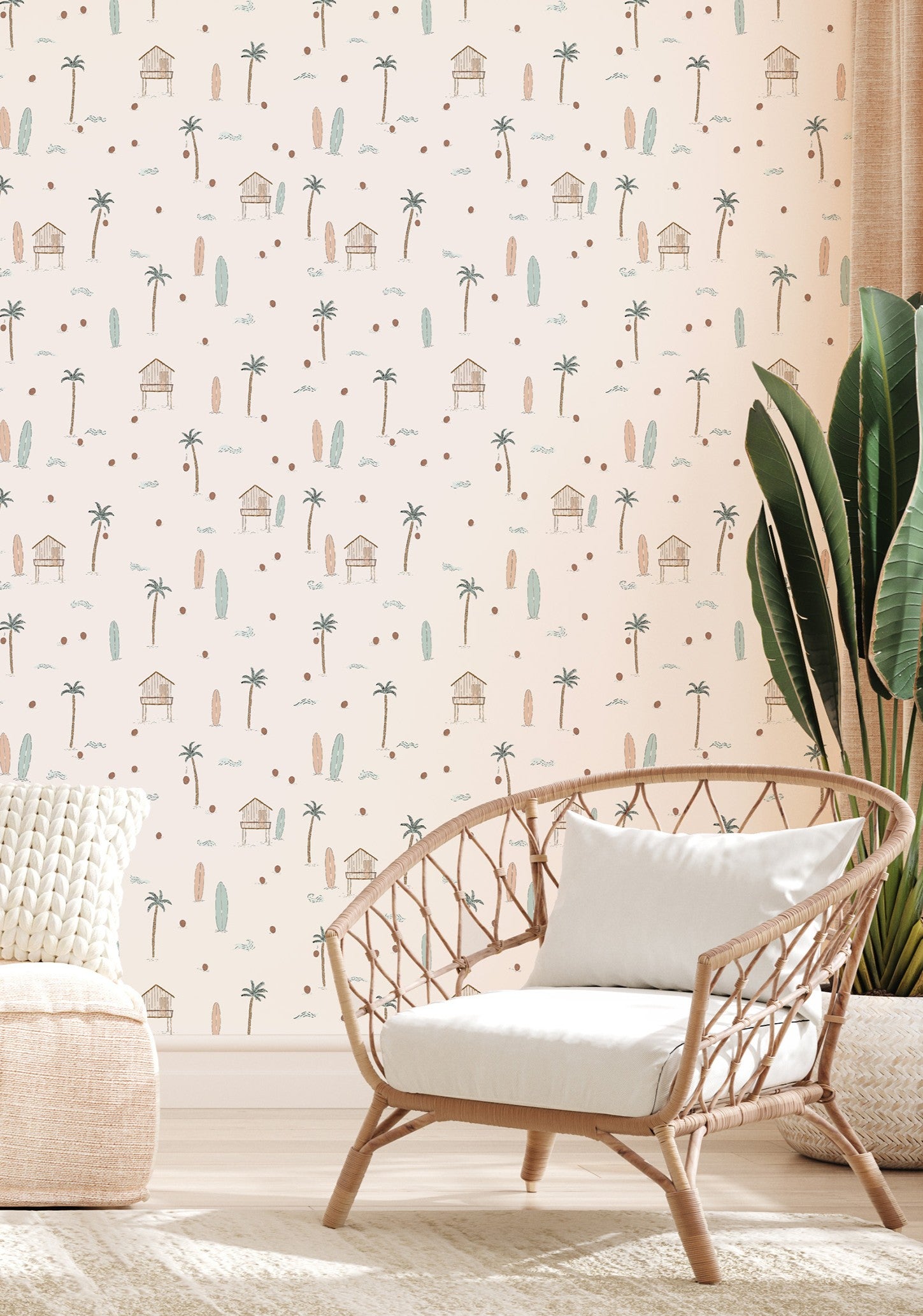 Wicker chair with white cushion against a wall with beach-themed wallpaper