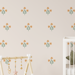 Sweet Spring floral wall decals spaced across a nursery wall with crib and soft neutral baby room styling