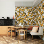 Tuscan Orange wallpaper wrapping two dining room walls with citrus pattern and brass chandelier