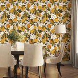 Tuscan Orange wallpaper accent wall behind a dining table with neutral chairs and soft natural light