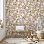 Viola Purple floral wallpaper used in a nursery with wooden bench seating and a small rocking chair