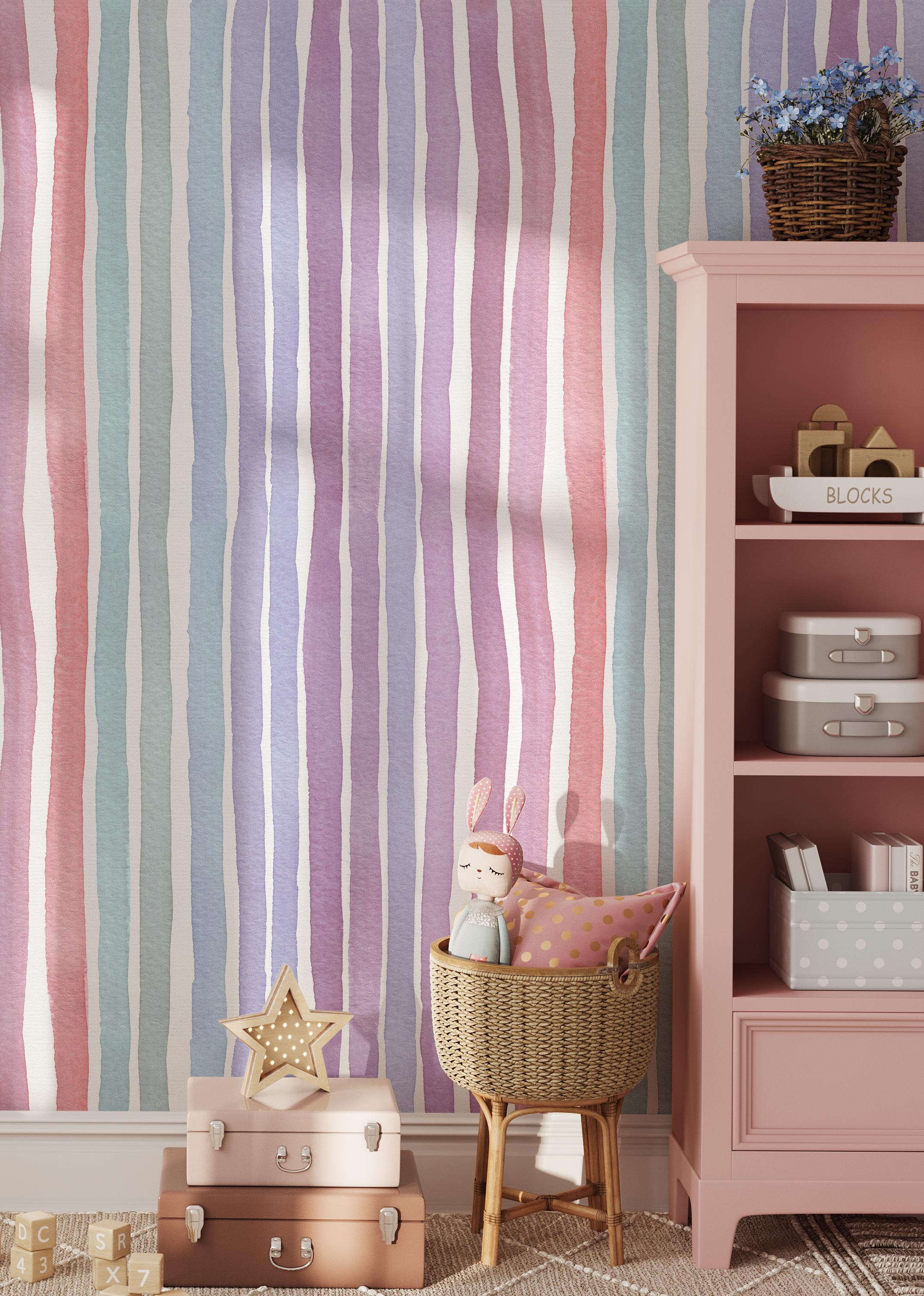 Pastel watercolor rainbow stripe wallpaper in a girl's nursery with blush bookcase and whimsical children's decor