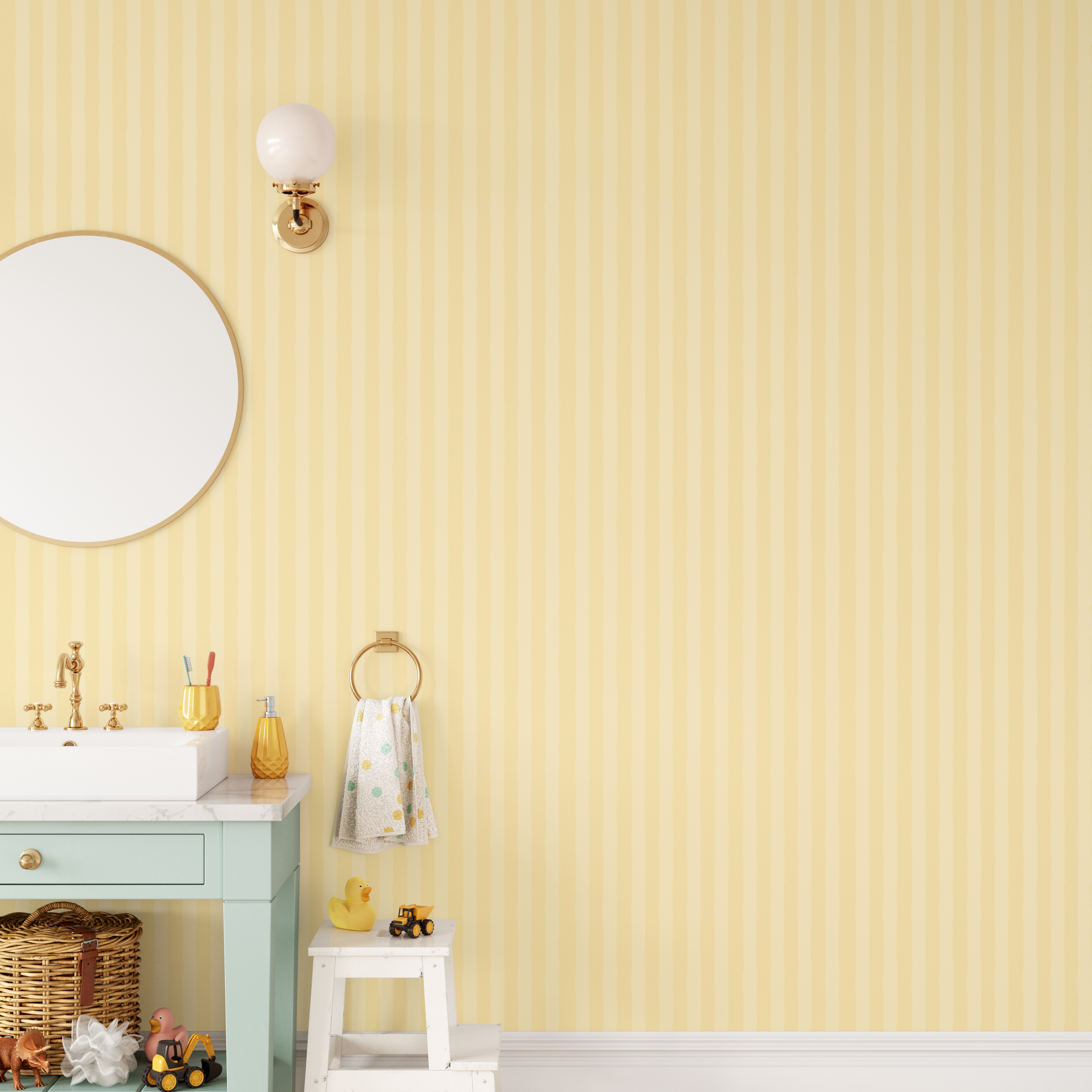 Yellow striped wallpaper in a playful bathroom with mint vanity and gold accents.